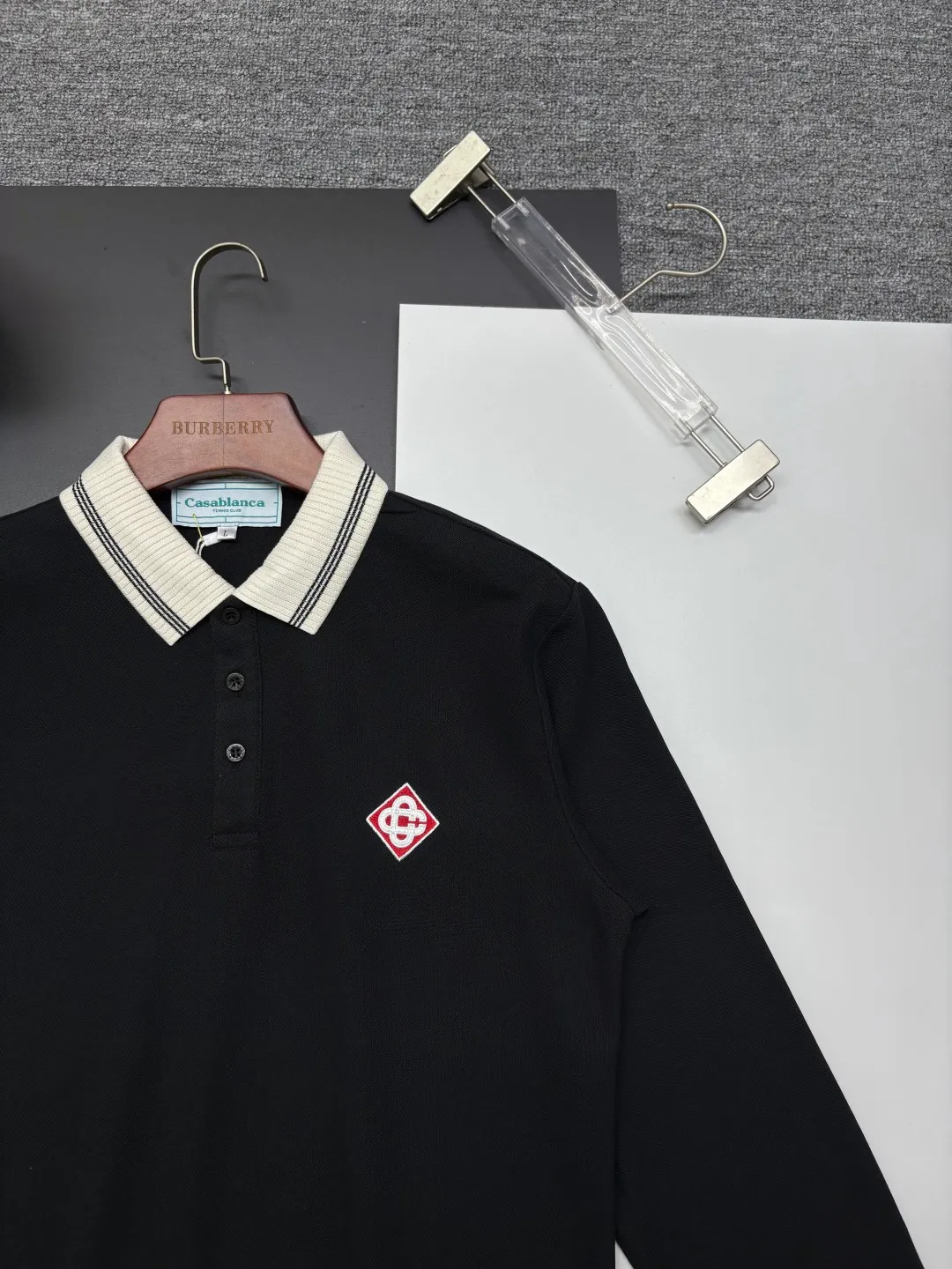 CASABLANCA New Arrival embroidered long-sleeved Polo shirt. Original fabric. Official Same Style. Made of pure cotton pique fabric, customized in the same vat. It feels very comfortable and smooth. The version is very wide and stylish. Produced by the first-line brand Factory. Imported Behringer embroidery machine. The embroidery is full and textured. The collar rib is woven with imported yarn. It will not deform after long-term wear. The most New Arrival style in spring and summer. Fashionable and individual. Super Versatile and good-looking. It is very suitable for both men and women. It is a must-have for everyone. Color: Black White Blue Size: M-3XL